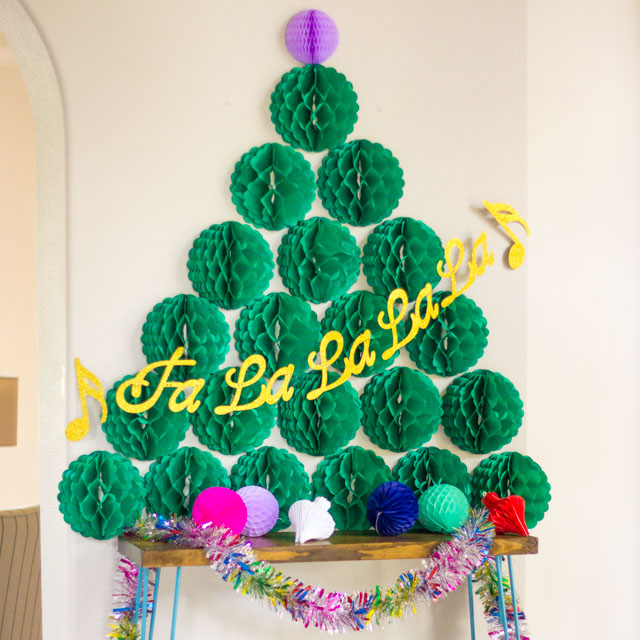 Such a fun decoration for a Christmas party - a honeycomb ball Christmas tree!