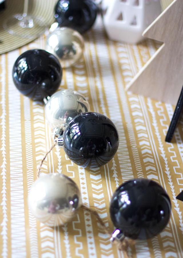 Love this idea for a simple Christmas ornament garland used as a table runner!