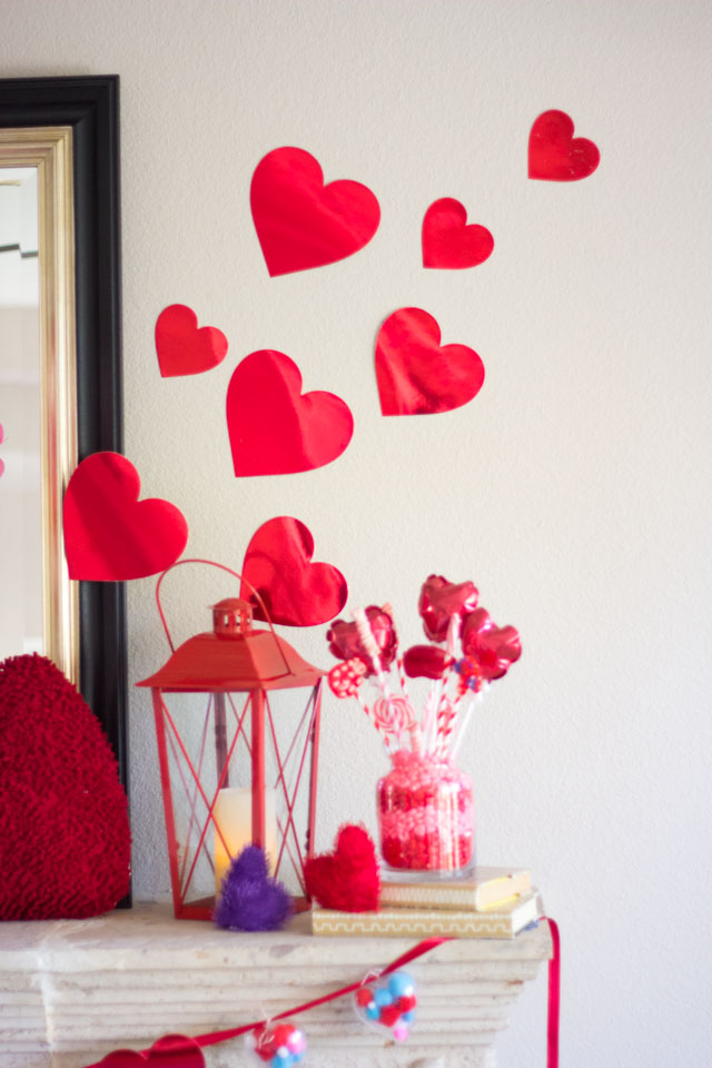 Check out this Valentine Mantel decor bursting with hearts!