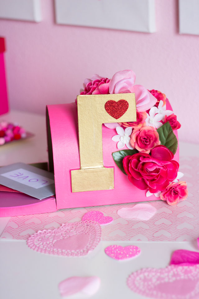 DIY Valentine's Mailbox - such a fun Valentine mailbox idea for girls using a paper mache mailbox and faux flowers!
