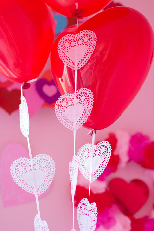 Add heart doilies to balloons for a fun Valentine's Day balloons craft!