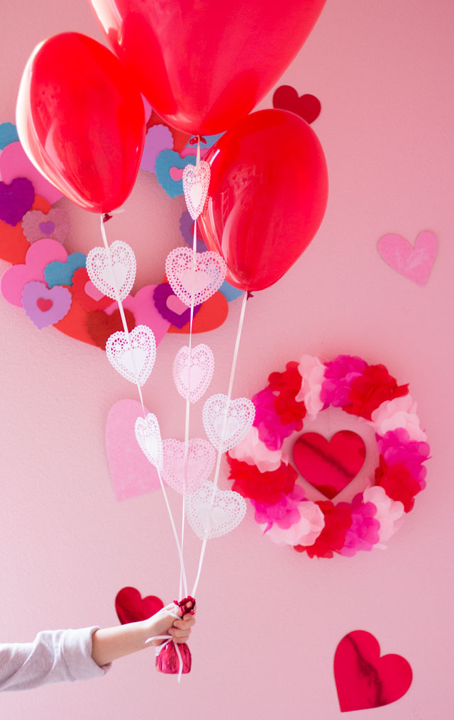 Add heart doilies to balloons to make the prettiest Valentine balloon bouquet! Add heart doilies to balloons to make the prettiest Valentine balloon bouquet!