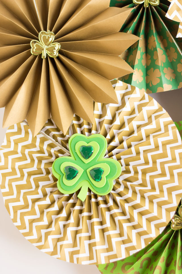 Make a St. Patrick's Day Wreath out of paper party fans and shamrocks!