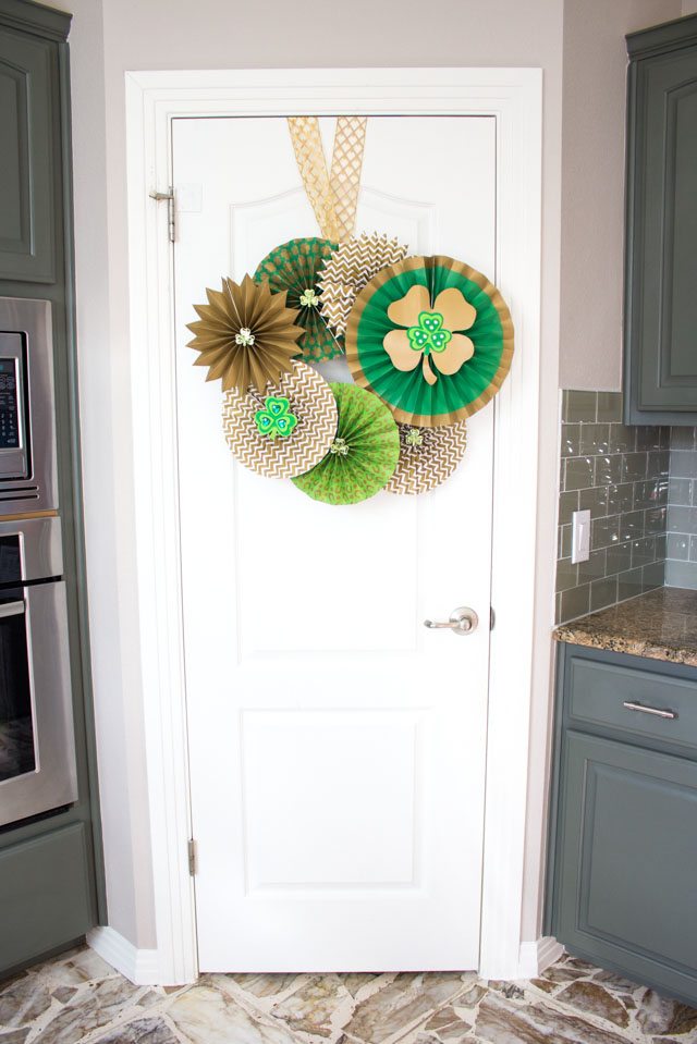 Make a St. Patrick's Day Wreath out of paper party fans and shamrocks!