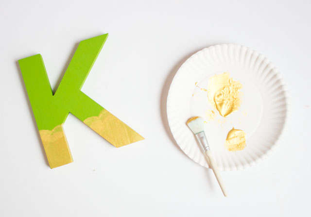 Paint wood letters to create this fun LUCKY banner craft for St. Patrick's Day!