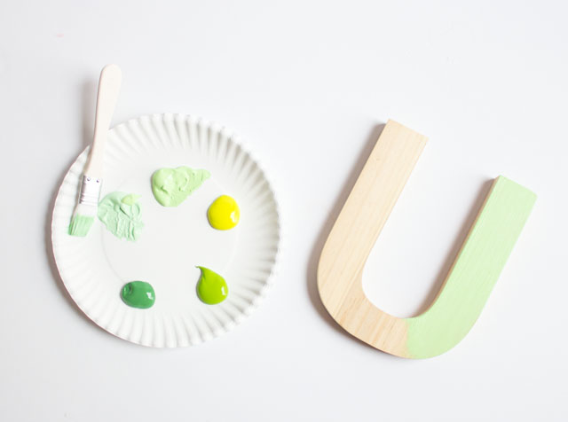 Paint wood letters to create this fun LUCKY banner craft for St. Patrick's Day!