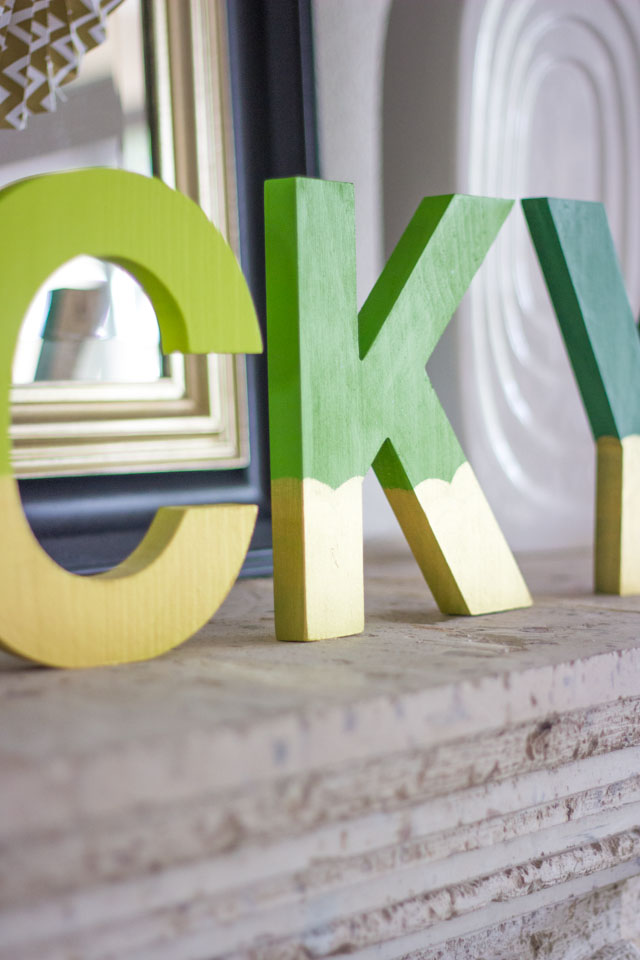 Paint wood letters to create this fun LUCKY banner craft for St. Patrick's Day!