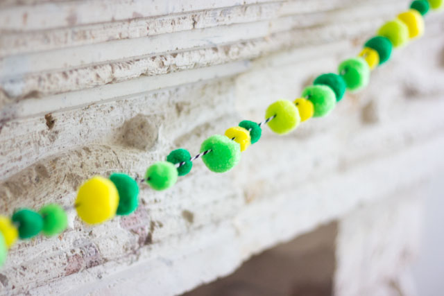 Make a simple pom-pom garland by stringing them onto baker's twine!