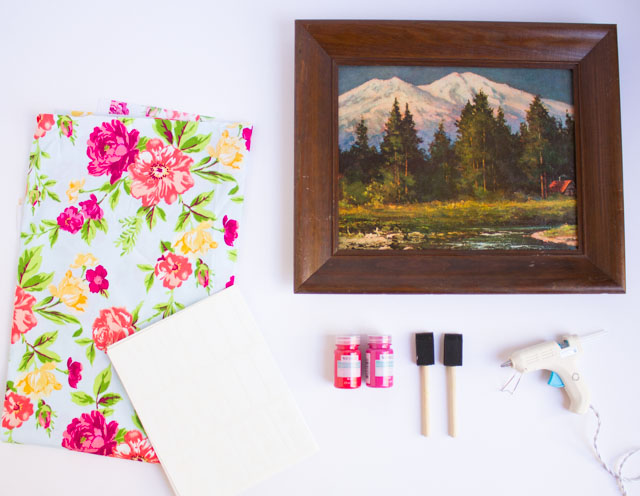 Such a fun thrift store makeover! Transform an old picture frame into this colorful Hello Spring fabric art!