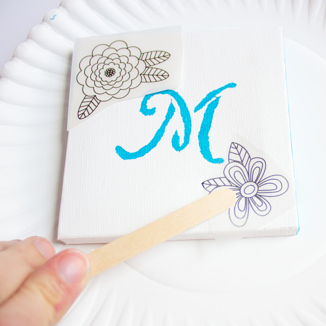 Make this monogram desktop art from mini canvases and floral rub-ons. A perfect personalized Mother's Day or birthday present!