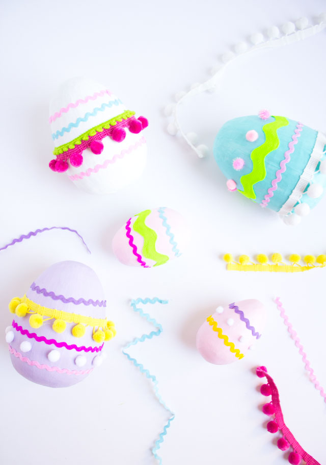 Make these colorful pom-pom trim Easter eggs from giant paper mache eggs!