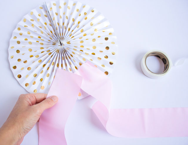 How to make a DIY giant ribbon banner with party fans