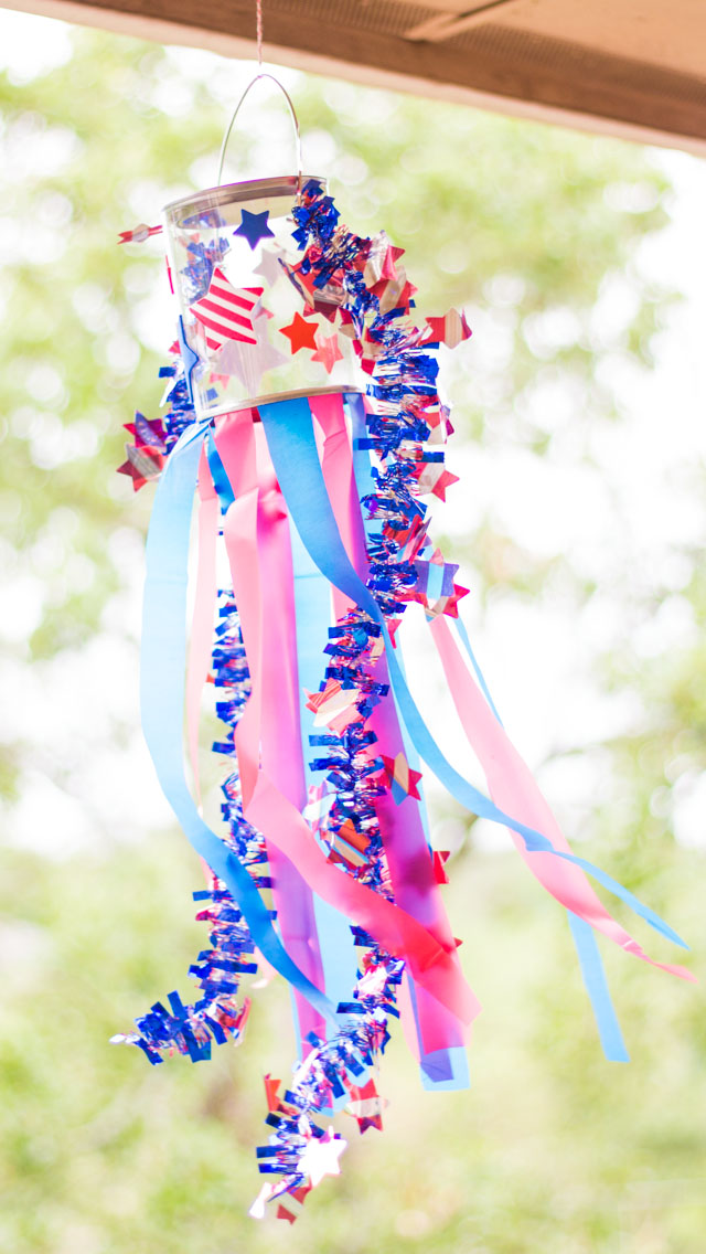 Make these simple patriotic windsocks for the 4th of July with stickers, plastic tablecloths, and a clear paint can. So easy!