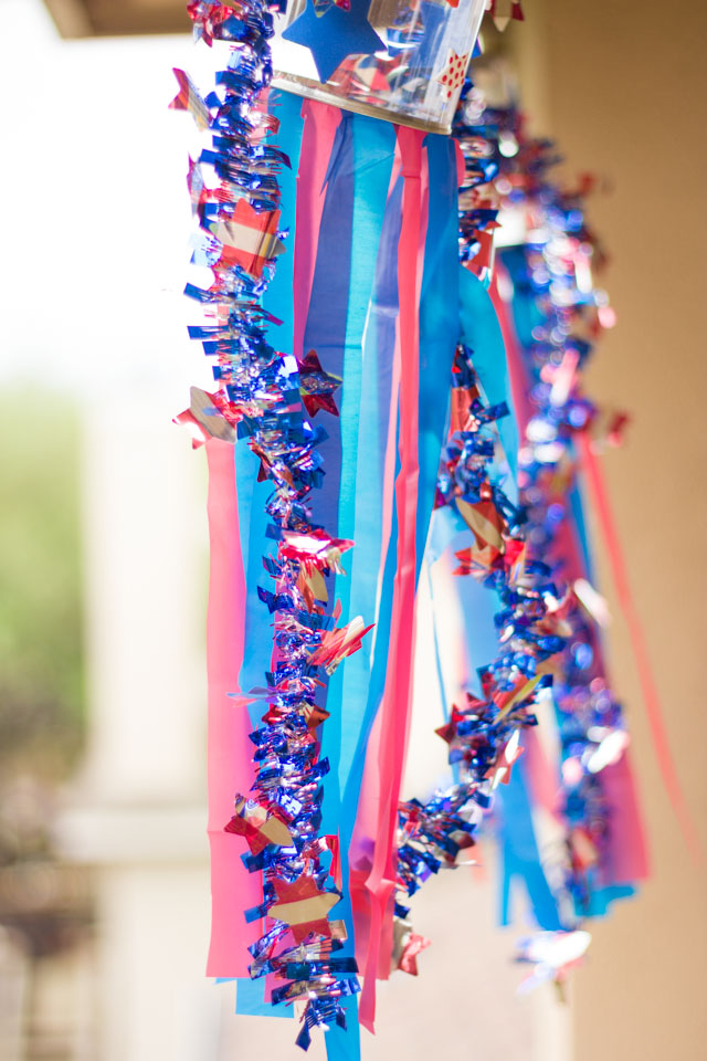 Make these simple patriotic windsocks for the 4th of July with stickers, plastic tablecloths, and a clear paint can. So easy!
