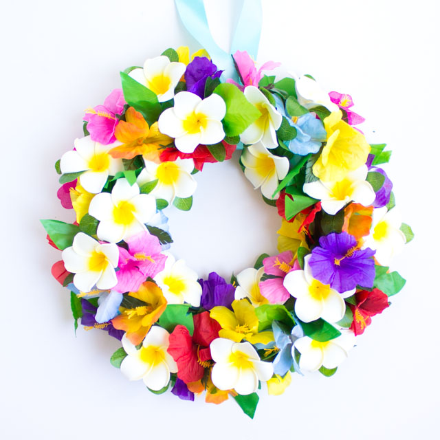 Make this tropical flower wreath for your front door this summer! It would also be perfect for a luau or pool party!