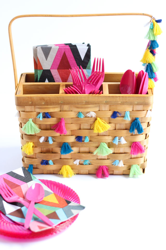 Decorate a basic picnic utensil basket with tassels for boho inspired summer entertaining!