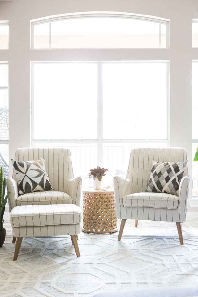 Mid century arm chairs paired with hide and leather accent pillows!