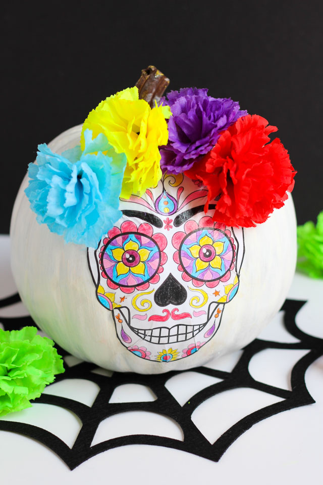 Create this DIY Day of the Dead pumpkin with an adult coloring book page!