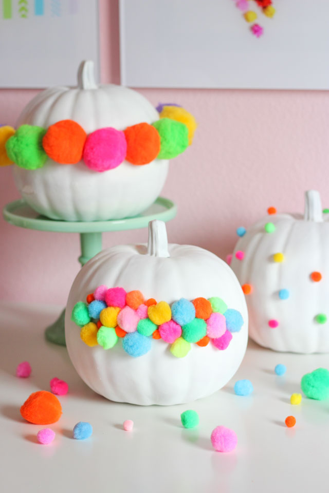 A fun no-carve pumpkin idea - decorate them with pom-poms!