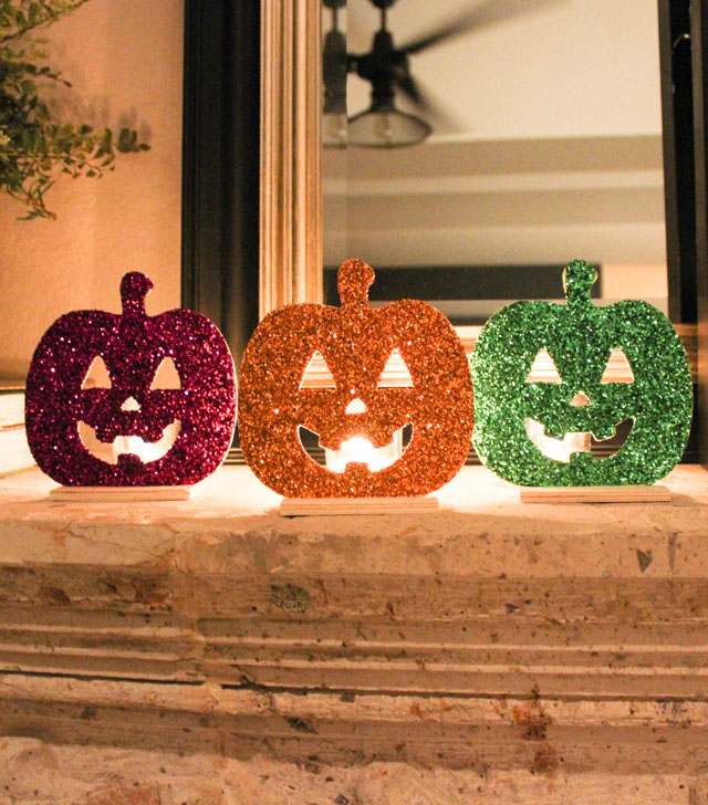 Make these glittery jack-o-lantern lights with a wood pumpkin and votive! Make these glittery jack-o-lantern lights with a wood pumpkin and votive!