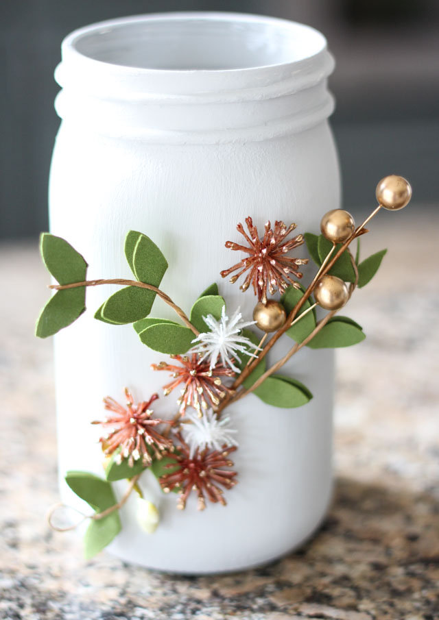 Such a pretty mason jar craft idea - winter floral vases!