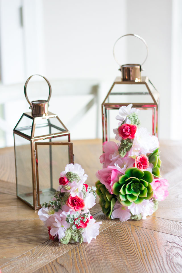 These faux floral lanterns would be perfect for a spring wedding or shower centerpiece!