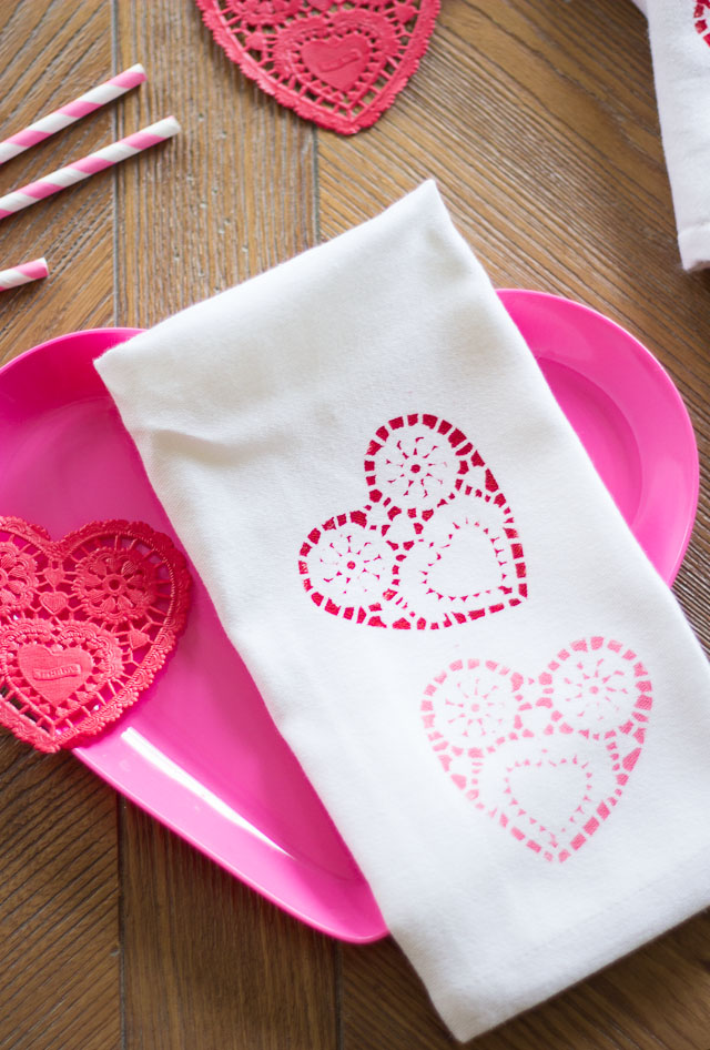 Valentine's Day heart napkins stenciled with paper heart doilies!