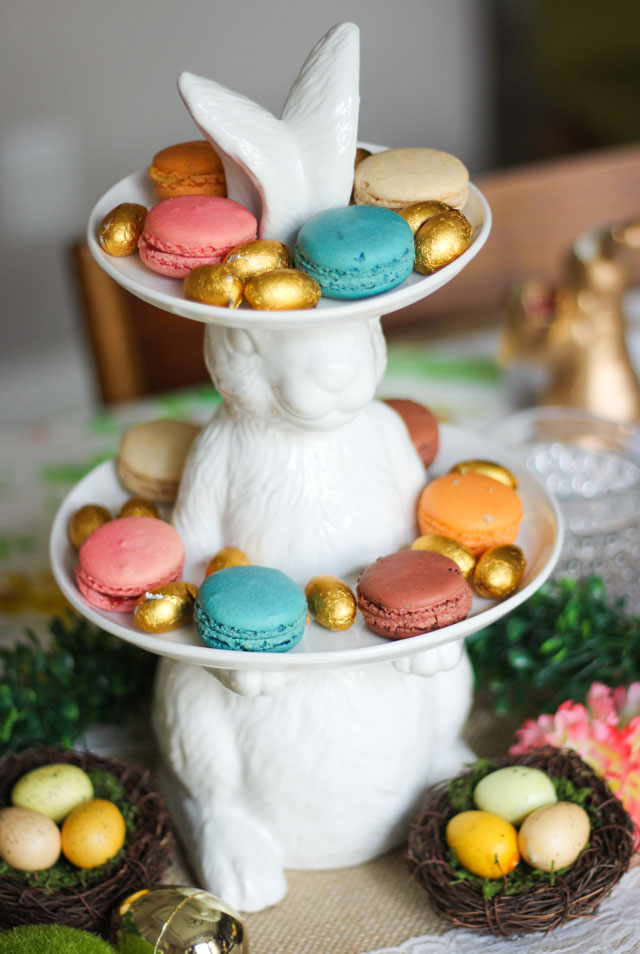 Love this Easter table idea filled with flowers and bunnies! #eastertable #easterbrunch #easterdecor #eastercenterpiece