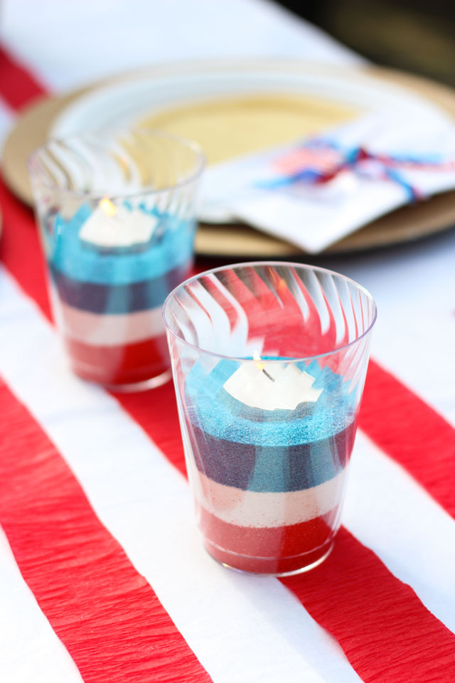 Make patriotic red, white, and blue sand votives for Memorial Day! #memorialday #fourthofjulycraft #memorialdaycraft #patrioticcraft #sandvotives