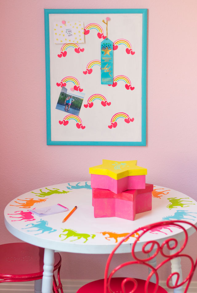 Create a kids workspace decorated with rainbow and unicorn stencils! #unicorndecor #rainbowdecor #kidstable #corkboard