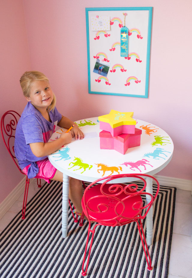 Create a kids workspace decorated with rainbow and unicorn stencils! #unicorndecor #rainbowdecor #kidstable #corkboard