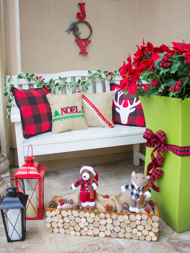 This fabulously plaid Christmas front porch is full of simple plaid decorating ideas! #plaid #plaidchristmas #christmasfrontporch #christmasdecor #plaidcrafts