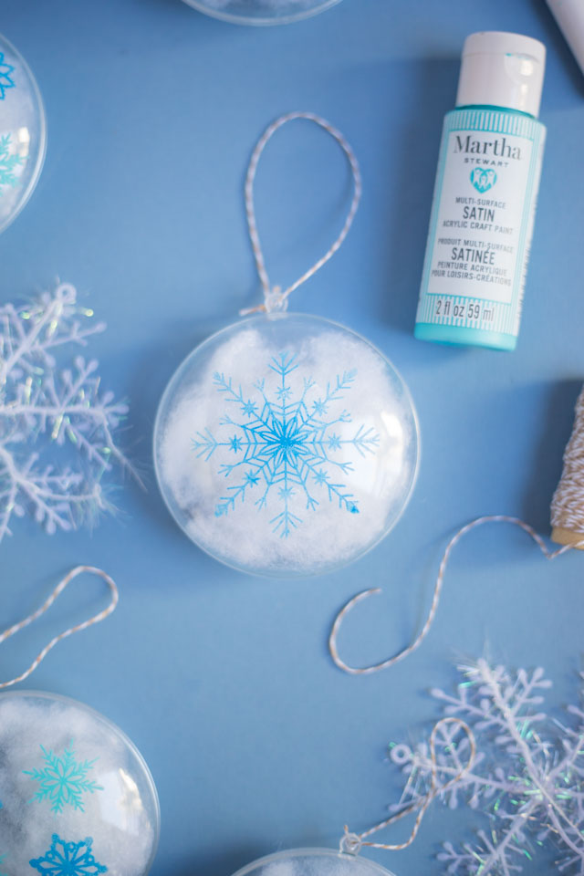 Stencil clear ornaments with snowflakes and fill them with snow! #christmasornaments #snowflakeornaments #clearornaments #marthastewartcrafts #plaidcrafts