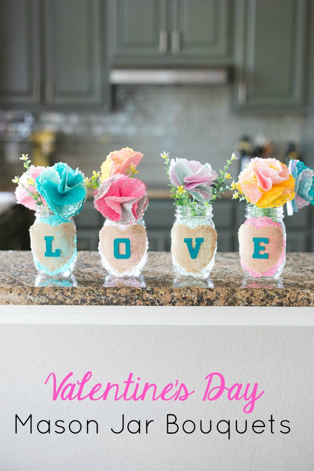 These mason jar bouquets filled with doily flowers are a pretty DIY Valentine's Day decoration or centerpiece! #valentinecrafts #valentinescrafts #masonjarcrafts #doilycrafts #doilyflowers #paperflowers #valentinesdaycrafts