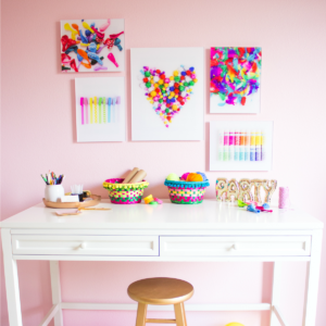 pink-craft-room-with-colorful-wall-art
