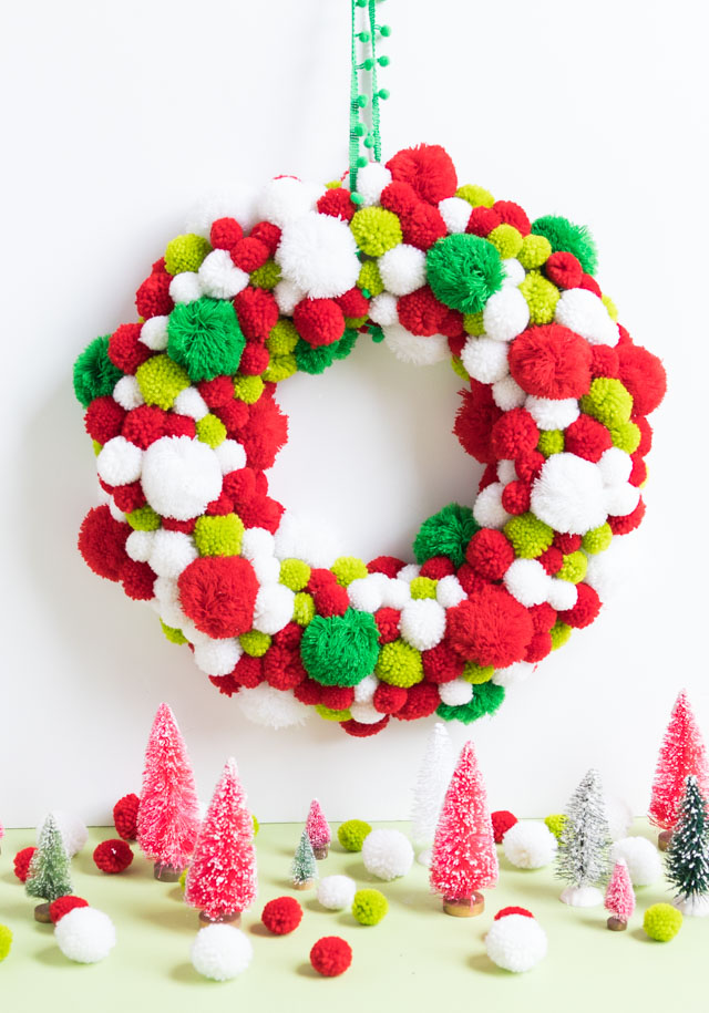 Christmas wreath with red, green and white pom-poms