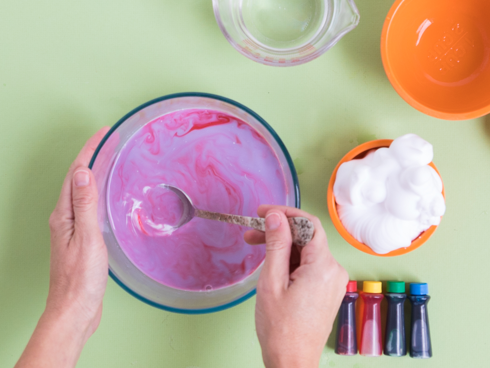 Adding food coloring to fluffy slime