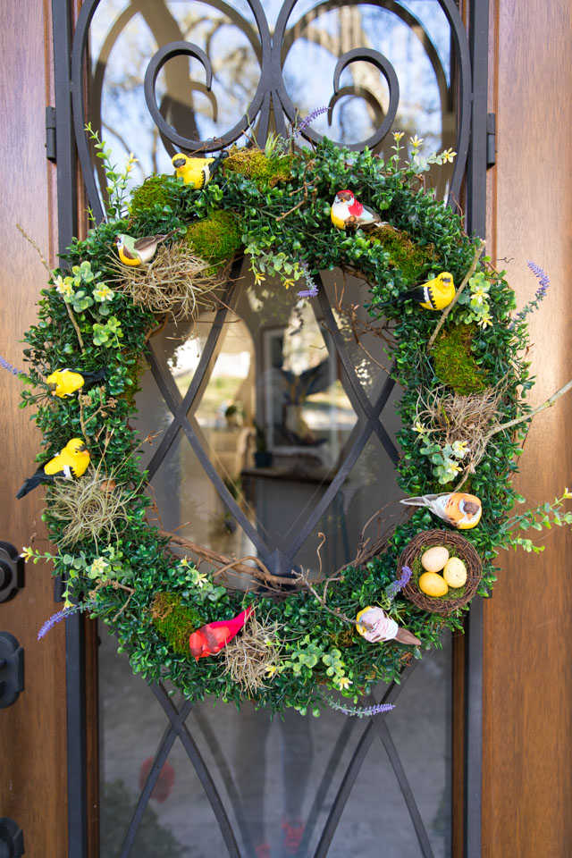 Spring wreath with bird to hang against a door