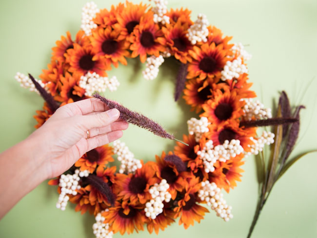 Adding cattails to fall wreath