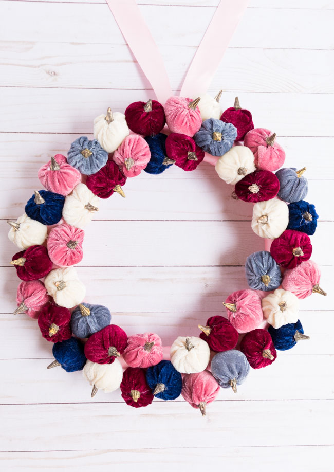 Modern fall wreath with pink and blue velvet pumpkins from Hobby Lobby
