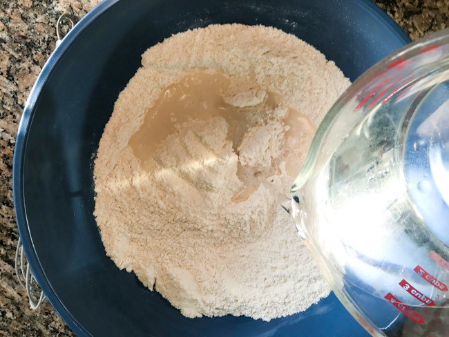 Adding water to flour and salt for salt dough ornaments