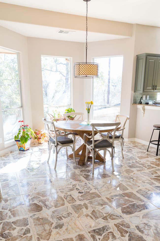 Kitchen with agglomerate stone tiles after tile floor refinishing