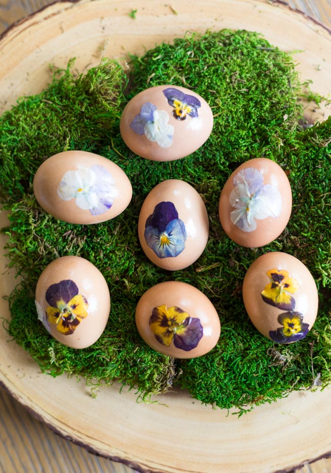 Nature inspired pressed flower Easter eggs on moss